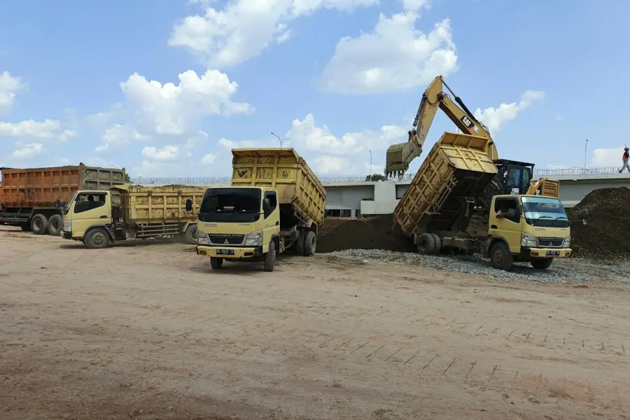 Several tipper lorries on a site